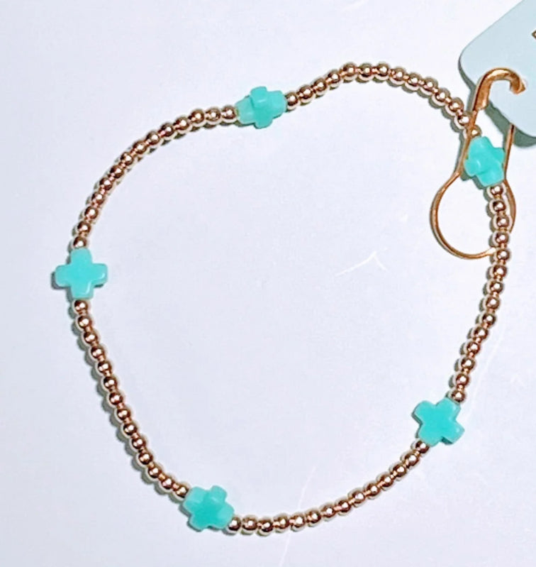 E NEWTON E GIRL SIGNATURE CROSS SMALL GOLD PATTERN 2MM BEAD BRACELET