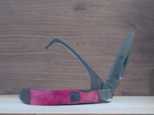 TWISTED X 4 1/4” CLOSED HOOF PICK W/ SERRATED BLADE KNIFE, PINK
