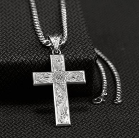 TWISTER SCROLLED CROSS NECKLACE