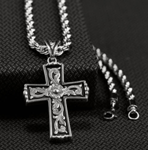 TWISTER SCROLLED CROSS NECKLACE