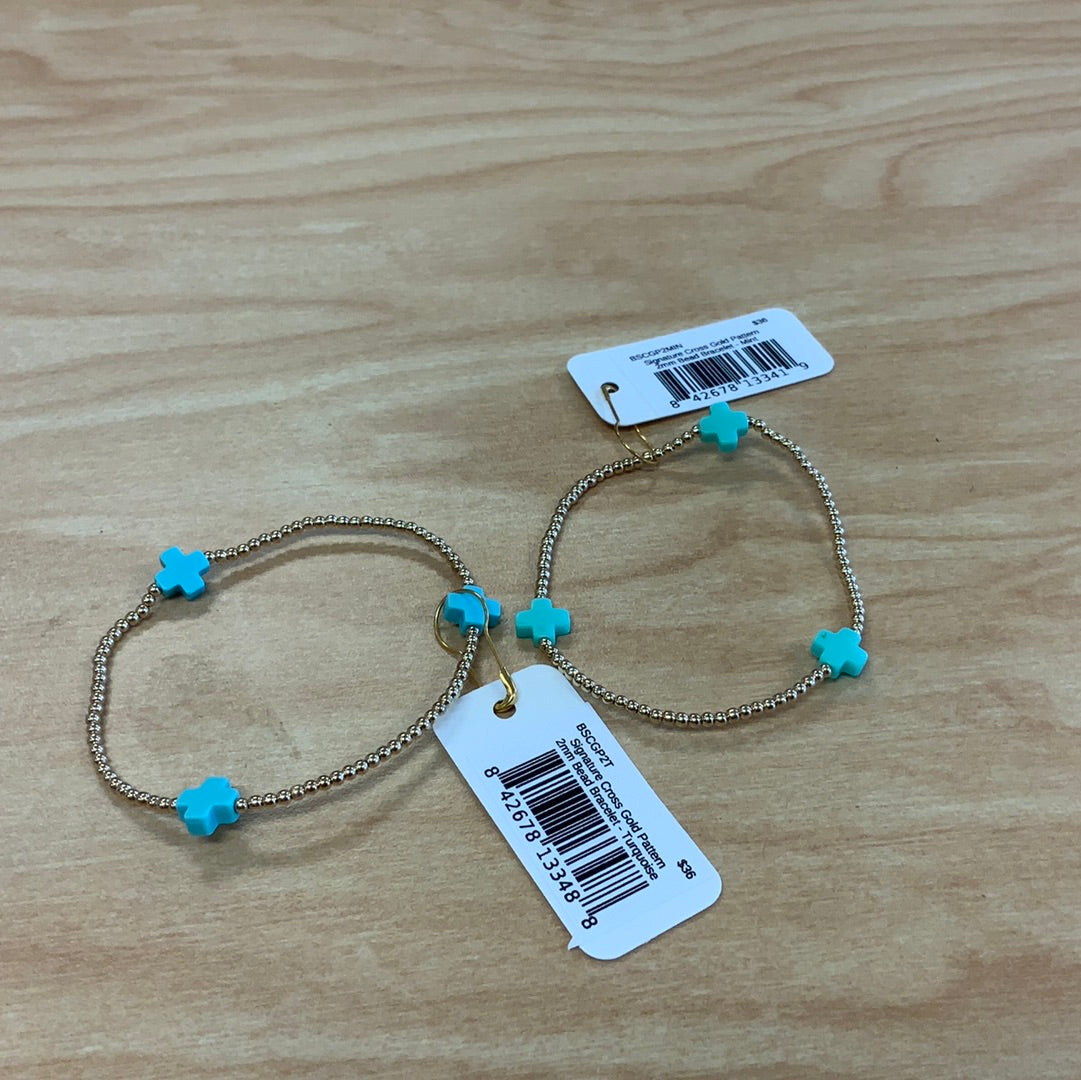 E NEWTON SIGNATURE CROSS GOLD PATTERN 2 MM BEAD BRACELET