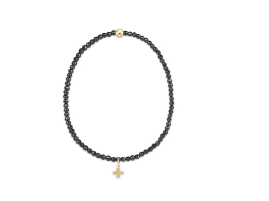 E NEWTON EXTENDS FACETED HEMATITE 2MM BEAD BRACELET - SIGNATURE CROSS GOLD CHARM
