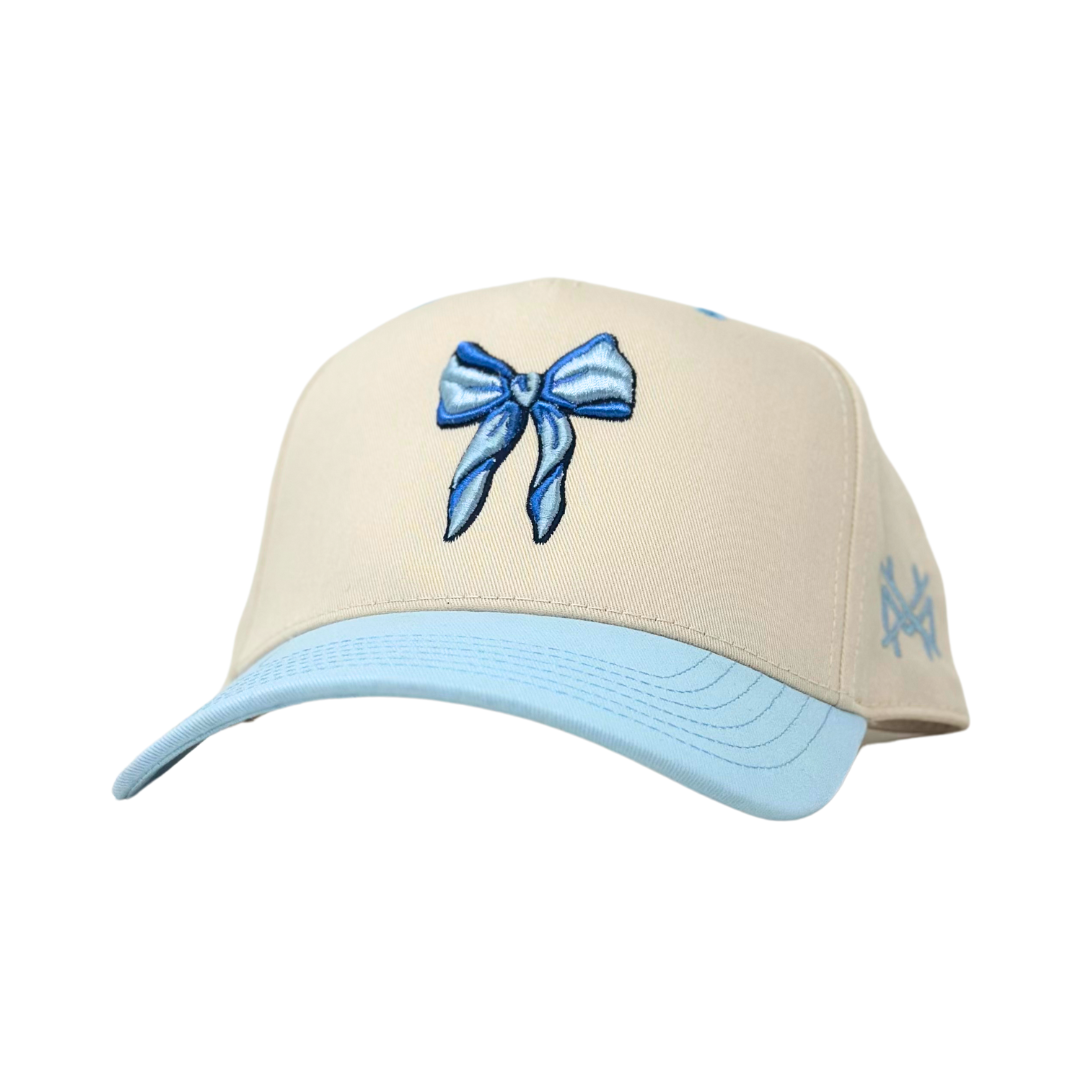 The Mad Hatter Co - MHC Bow Trucker Hat: Powder Blue/ Natural Otto