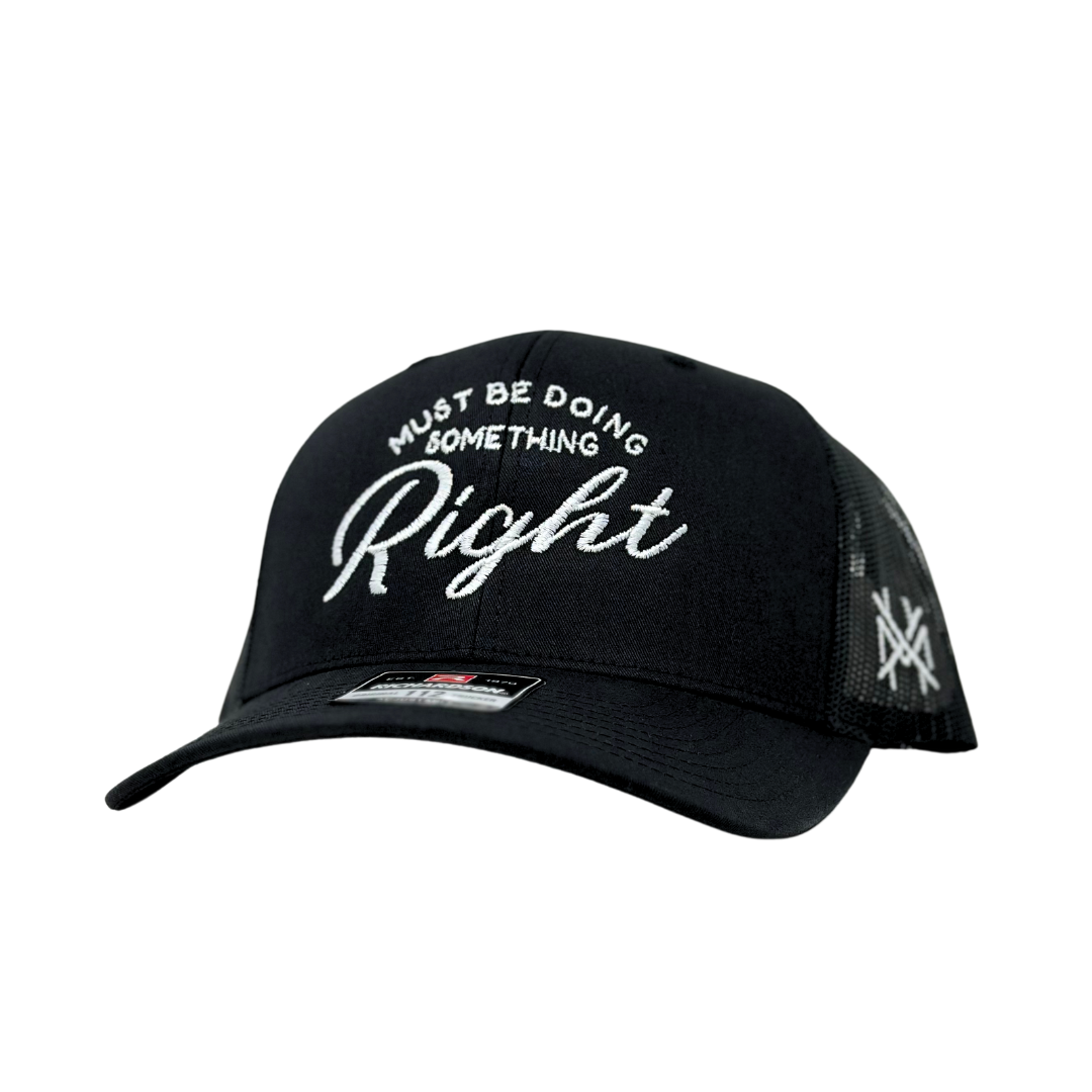 The Mad Hatter Co - MHC Must Be Doing Something Right Trucker Hat: Black/Natural Otto